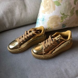 Metallic gold platform sneakers